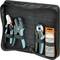 An open case with three pliers and an organiser with small metal parts. All tools are securely fastened.