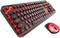 Black mechanical retro keyboard with round keys, on a red background, next to a matching red mouse.