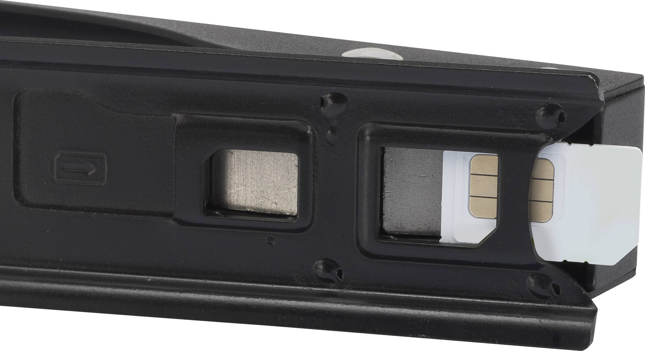 A black SIM card holder with a SIM card inserted. The contacts of the SIM card are visible.