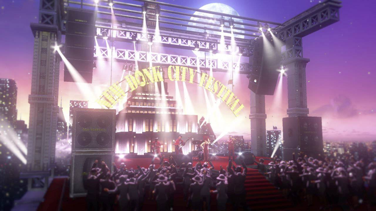 Crowds of people dance in front of an illuminated stage beneath a sign reading 'New Donk City Festival', at sunset in an urban setting.