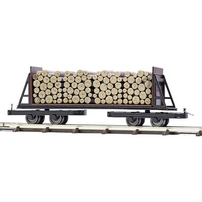 A railway wagon loaded with stacked timber logs on tracks.