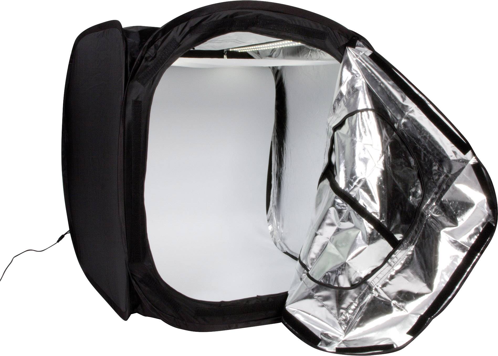 A black photography studio tent with a silver, reflective interior lining. The opening is unfolded, revealing its inner space.