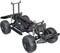 Remote-controlled model car chassis with visible drivetrain and suspension, displayed against a light background.