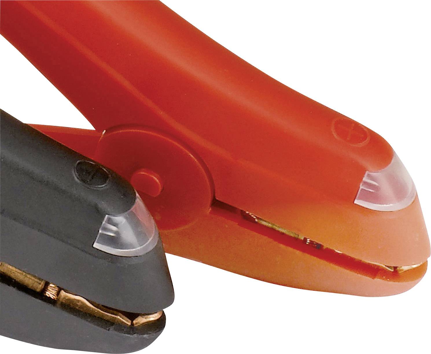 A black and a red stapler are lying side by side. The focus is on the front sections of both devices.