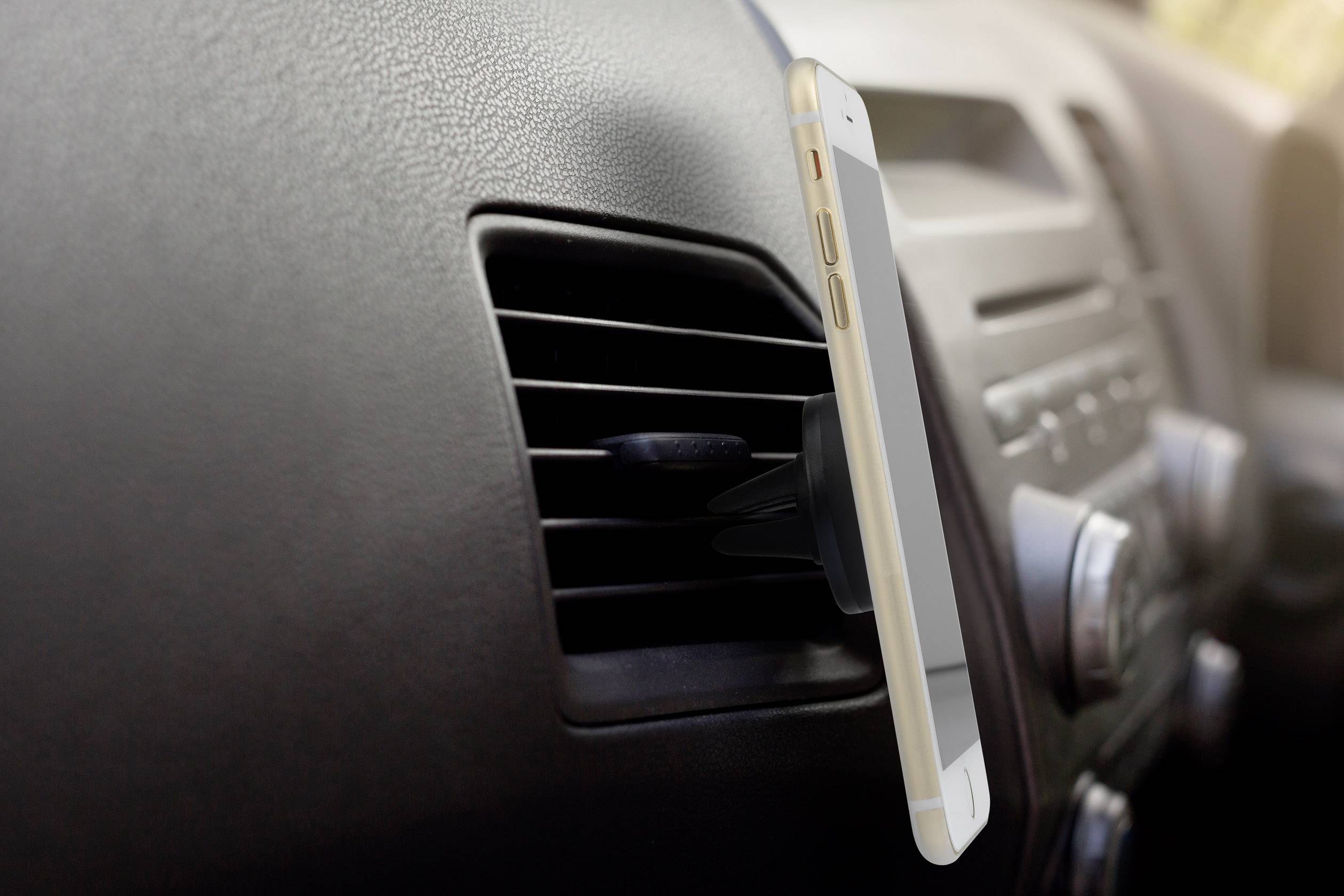 A smartphone mounted on a car air vent holder, demonstrating the user-friendliness and flexibility of the mobile phone mount.