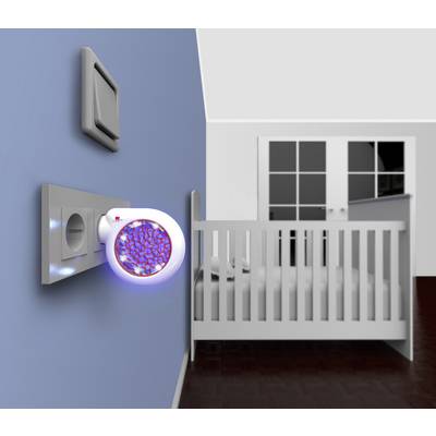 A night light in a socket glows in a child's bedroom next to a cot.