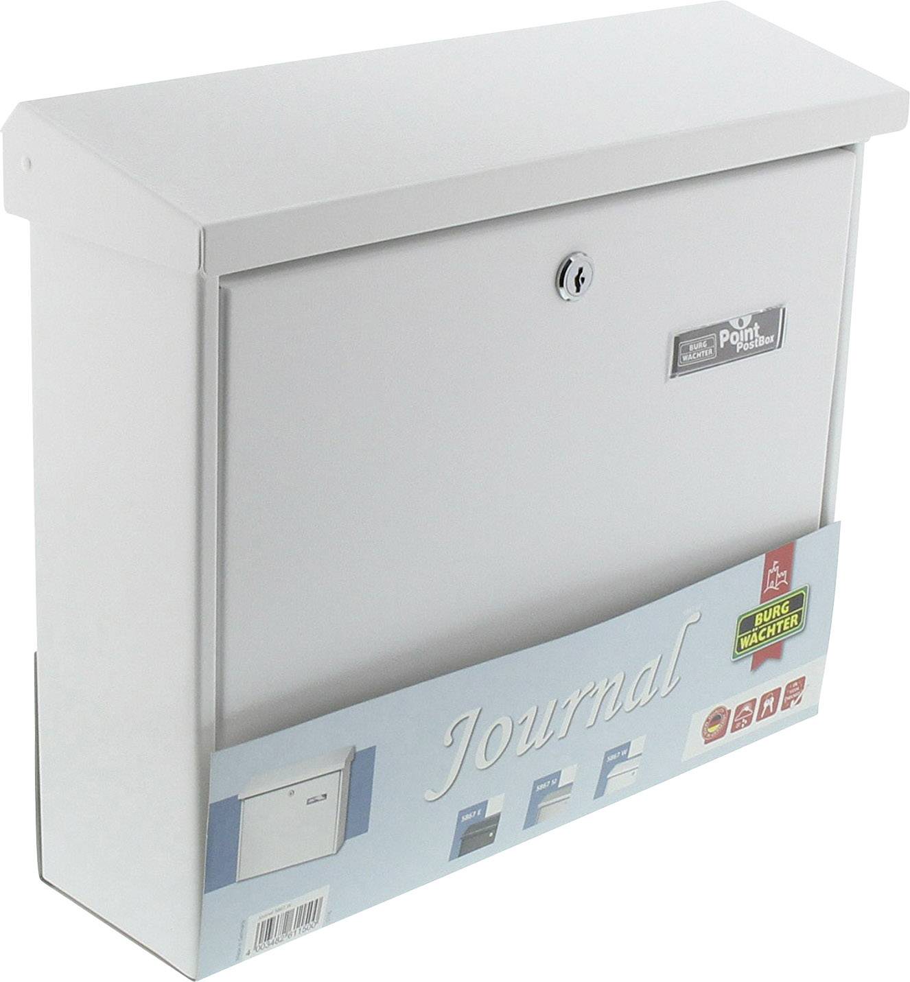 A white letterbox with a lock, marked as 'Journal', stands upright. A blue packaging with product information is located below it.