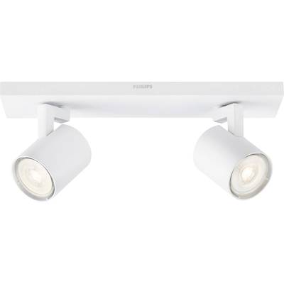 Two white, cylindrical ceiling spotlights by Philips, mounted on a rectangular base, are illuminating in different directions.