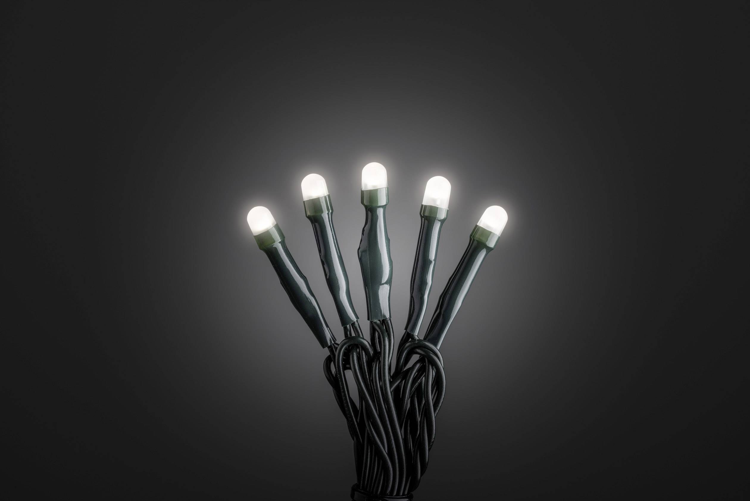 Five illuminated LED lamps against a dark background.