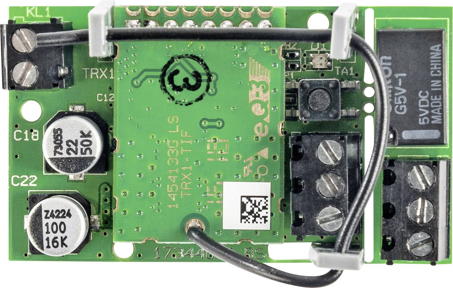 Green electronic circuit board with multiple capacitors, resistors, connectors, and a QR code in the centre.
