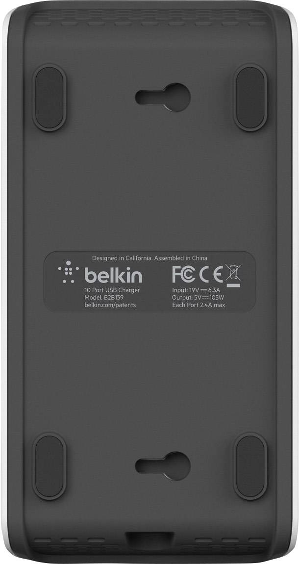 Black back side of a Belkin USB charger with four non-slip feet and technical specifications in the centre.