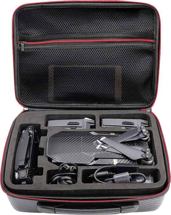 Black drone folded up in an open, foam-padded transport case with accessories such as cables and batteries.