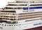A large model of a modern cruise ship, side view, with an Italian flag and the inscription 'www.aida.de'.