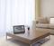 A modern, minimalist living room view featuring a coffee table displaying a digital clock showing '4:06 PM'.