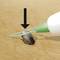 Tick Removal with a Tick Hook: The tick is carefully removed by a twisting motion. A black arrow indicates the direction.