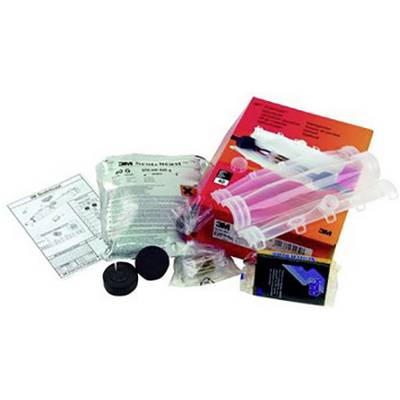 Various medical test kits and accessories on a surface, including packaging, tubes, and instructions, for laboratory purposes.