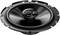 A round, black speaker with multiple screw holes around the edge is pictured. A small cap is located in the centre.