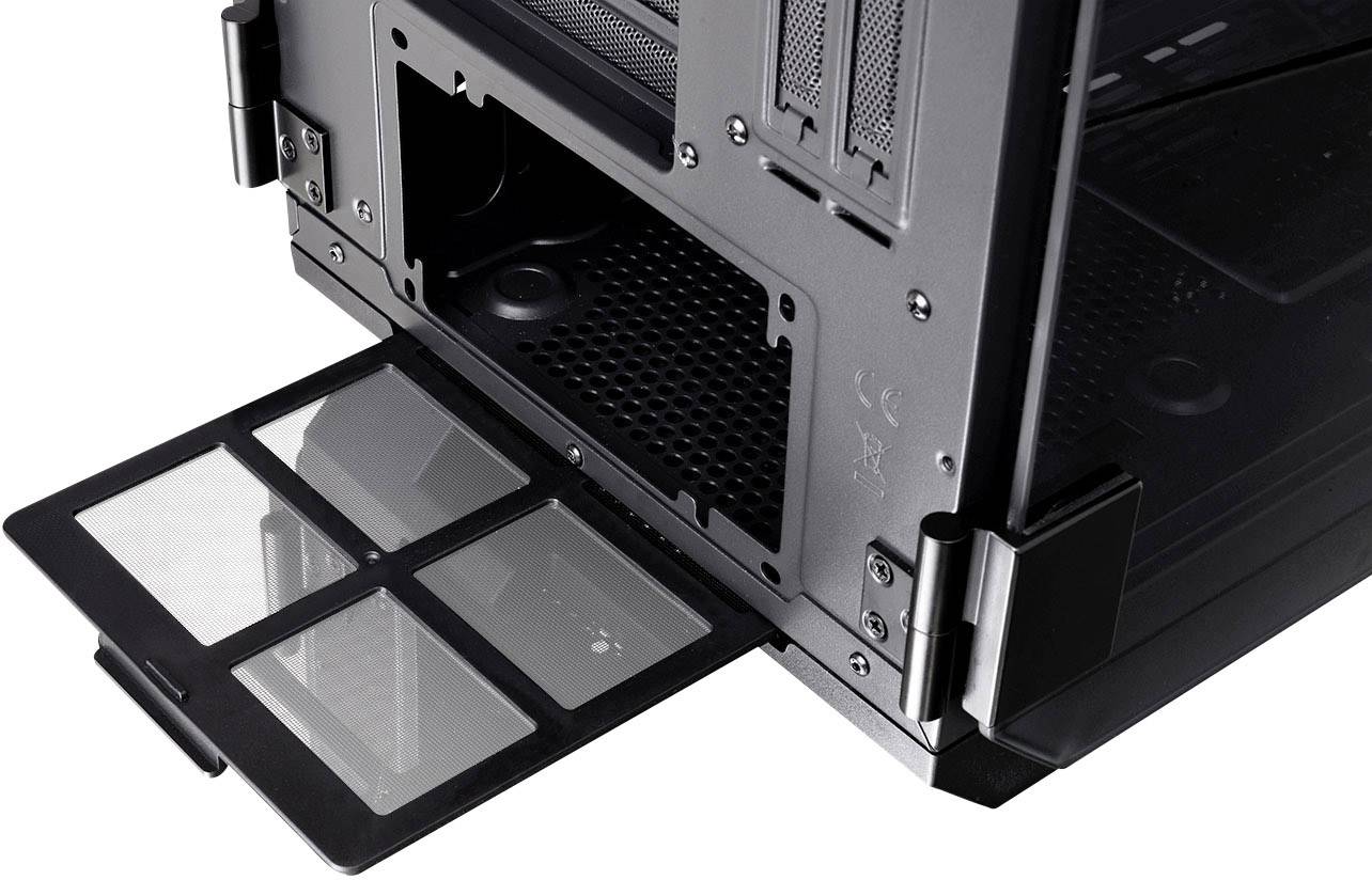 PC case rear with an open dust filter that has been pulled out. The case shows ventilation grilles and mounting points.