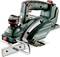 Electric hand planer with green casing and red switch, brand 'Metabo', model 'HO 18 LTX 20-82', resting on white background.
