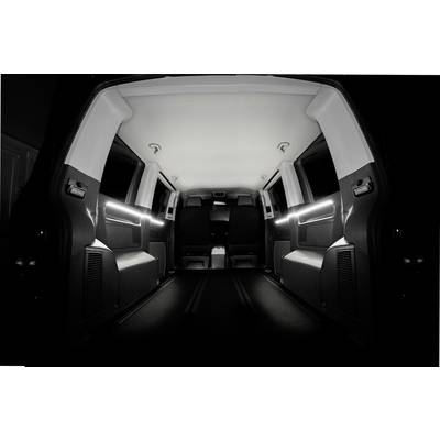 Interior view of an empty, well-lit delivery van. View from the back towards the front.
