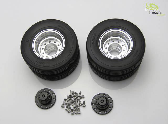 Two stacks of model tyres with rims, alongside wheel hubs and bolts.