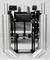 Industrial machine with two perforated metal cylinders and a central rectangular container. Function and context unknown.