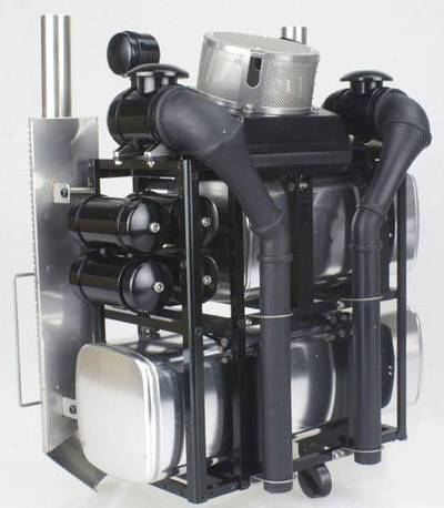 A complex exhaust system prototype with multiple cylinders and pipes, used for industrial applications.