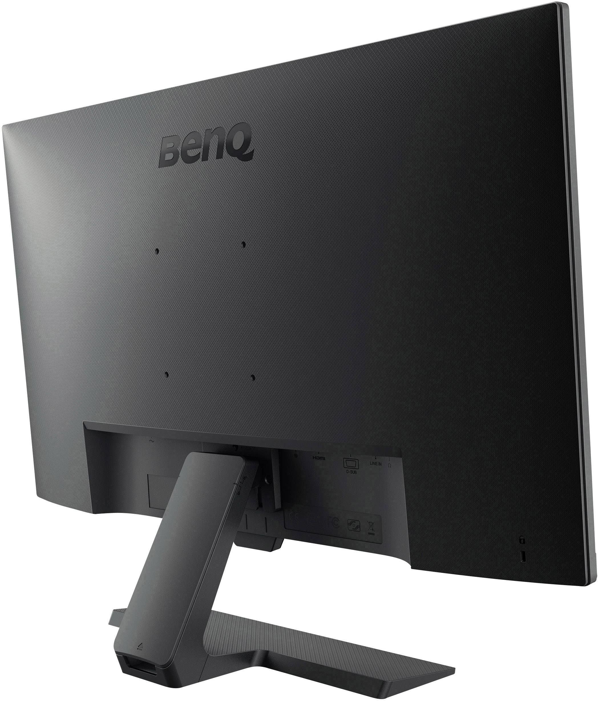 Back of a black BenQ monitor on a table, showing the monitor's tilt adjustment capability.
