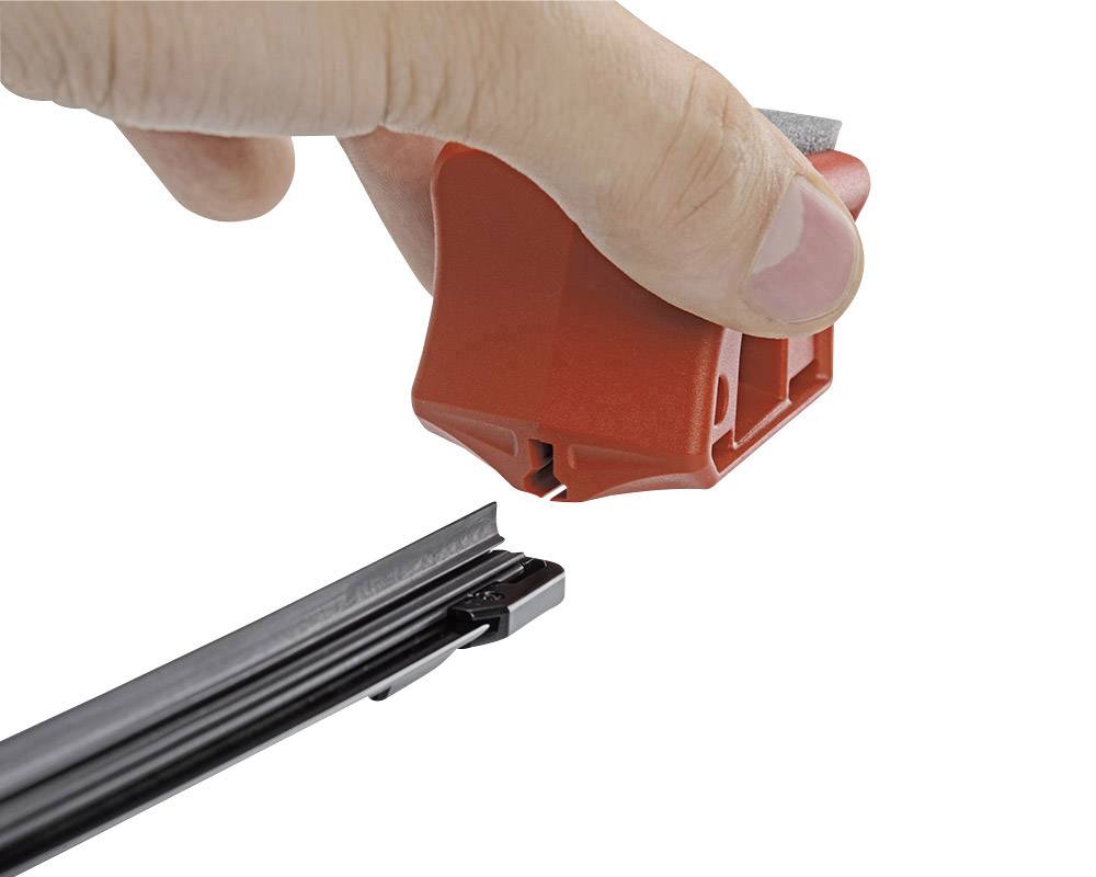 A hand holds a red tool over a black windscreen wiper arm, as if it is being adjusted or secured.