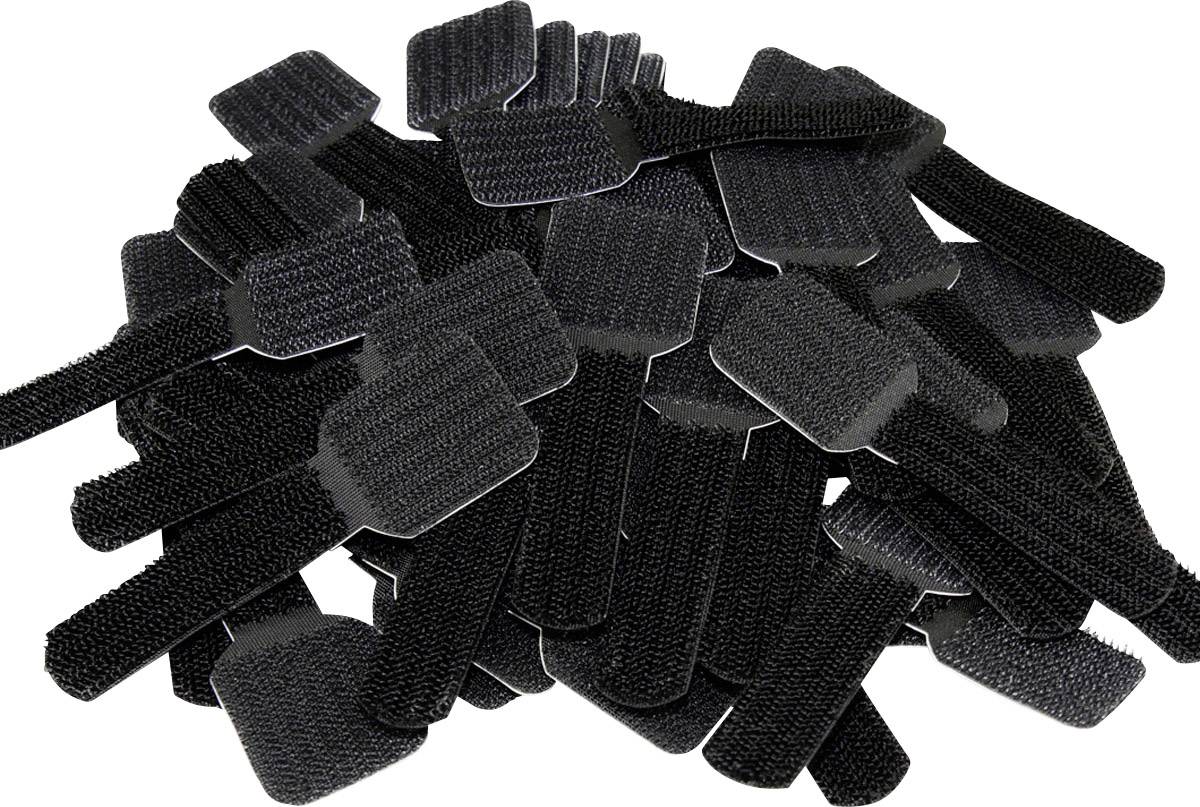 A stack of black hook-and-loop fasteners in a pile.<br><br>Note: In British English, this would typically be referred to as "hook-and-loop fasteners" (the generic term for Velcro), maintaining a neutral and precise description.
