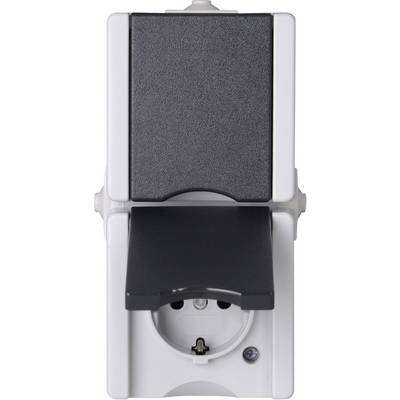 The image shows a white socket with a black cover. The flap is open, revealing the plug connection.