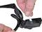 A person inserts a test strip into a blood glucose monitor attached to a pair of glasses.