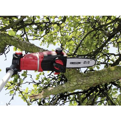 An electric pruning saw is cutting a branch high up in a tree. The blade is red and black, with the brand name visible.