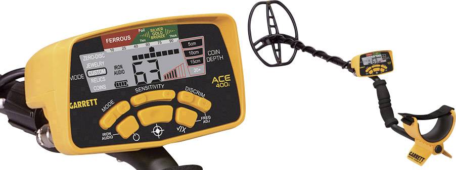 A yellow and black metal detector with a display showing various modes and settings, including 'SENSITIVITY' and 'MODE'.