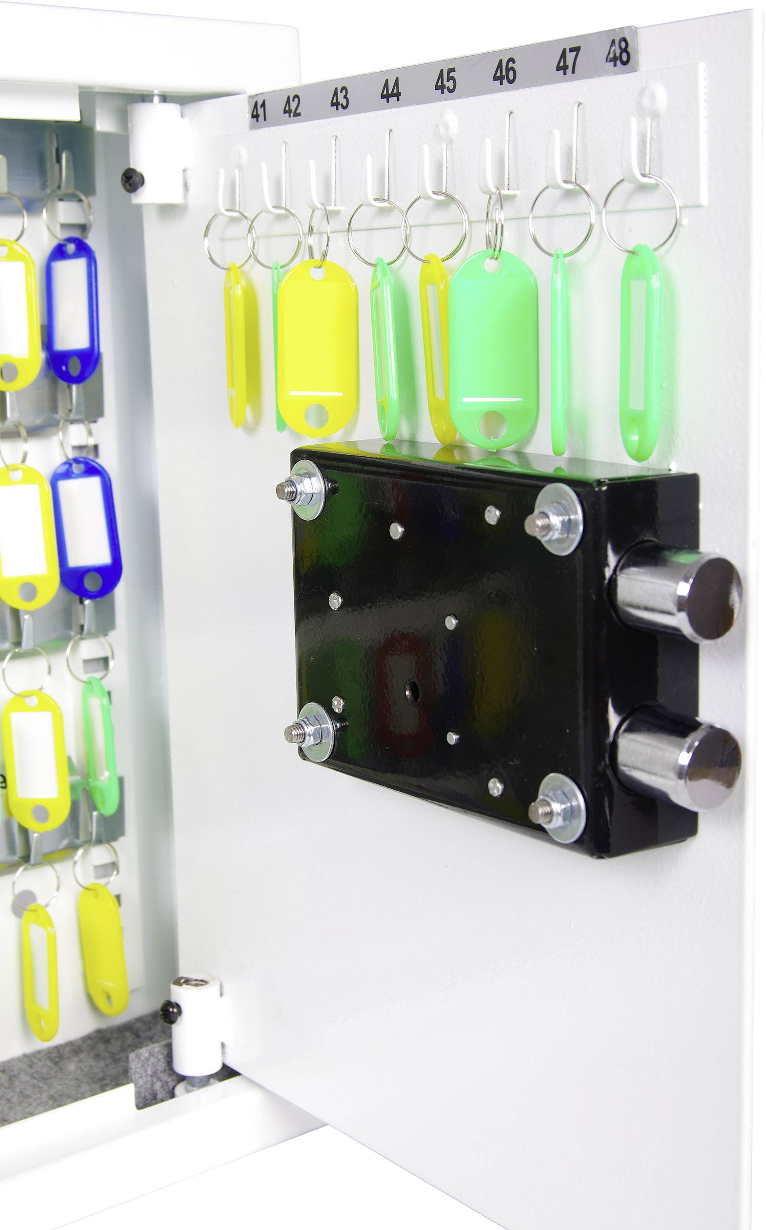 An open key cabinet with numbered hooks. Colourful key fobs hang on hooks 43 to 48 on the door.