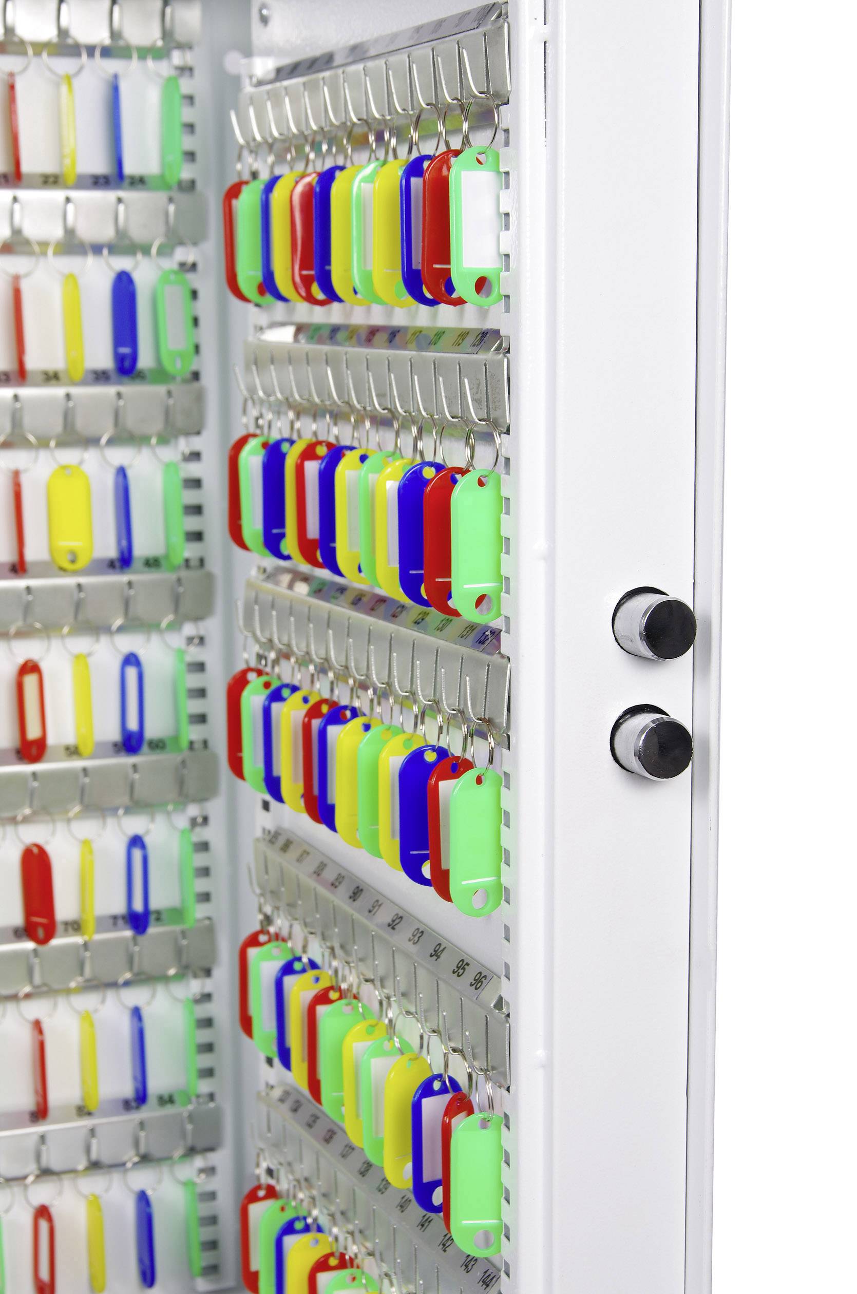An open key cabinet displays numerous colourful key fobs hanging on hooks in an orderly pattern.
