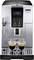 Silver coffee machine with a digital display, two spouts and two glasses of espresso underneath. Display reads: 'Select your beverage'.