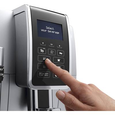 A hand selects a drink on a modern fully automatic coffee machine with a digital display and various selection options.
