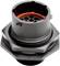 The connector features a round, black plastic casing with multiple openings and an orange sealing ring inside.