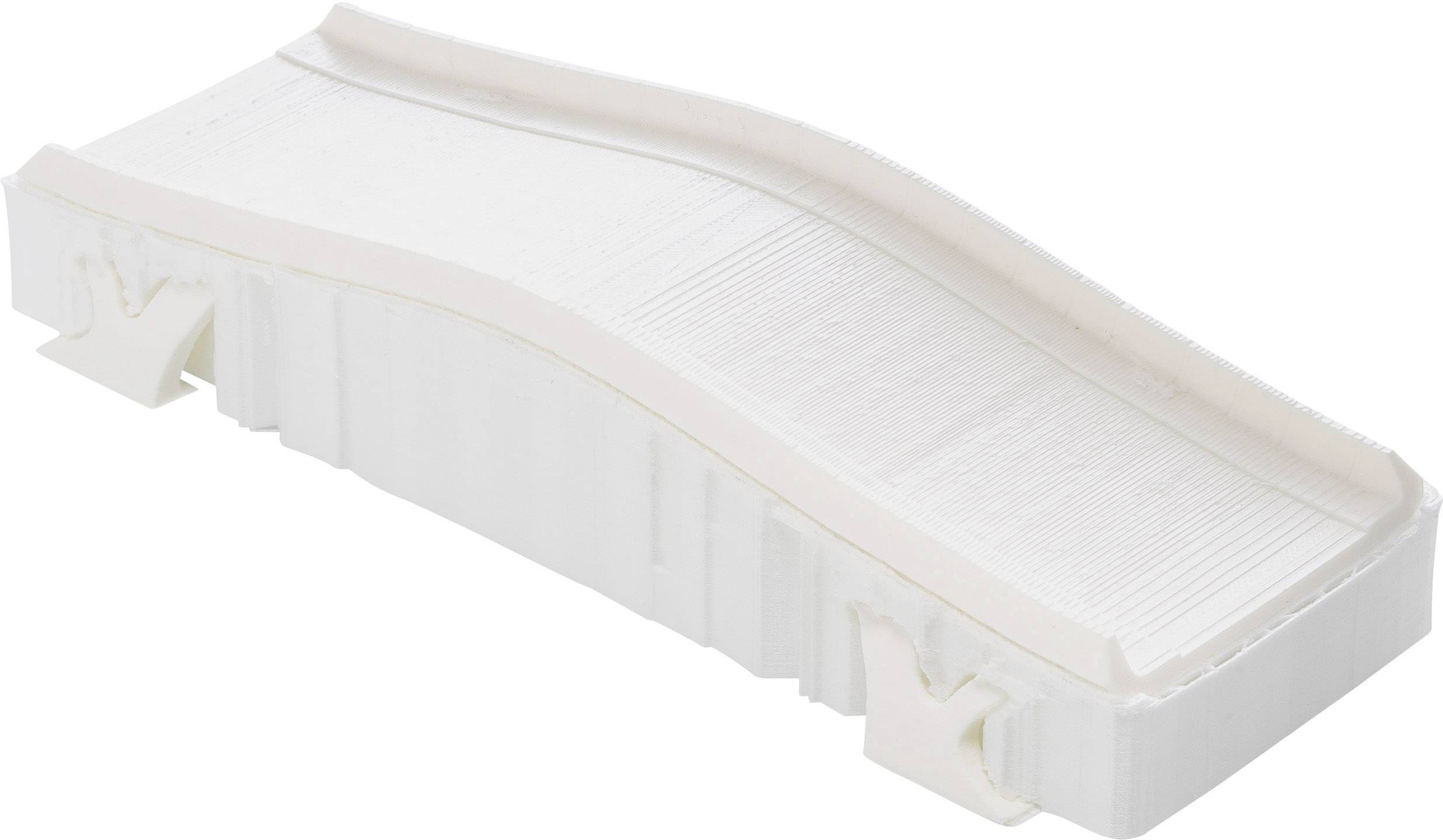 A white, rectangular filter with a slightly undulating surface, used for air or liquid purification in technical devices.