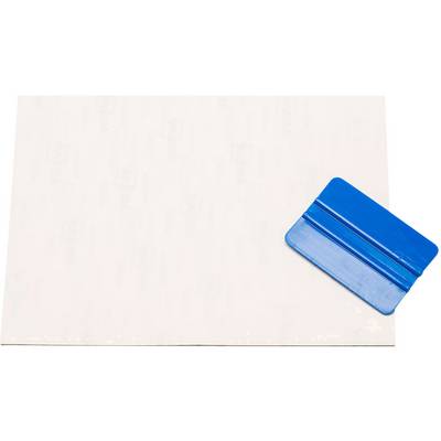 White transfer paper bottom left with blue plastic squeegee top right.