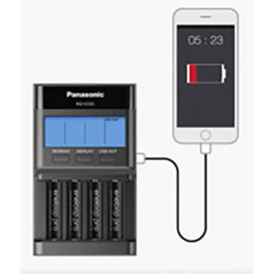 A battery charger is charging four AA batteries and is connected to a smartphone that is displaying a low battery level.