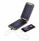 A mobile phone is being charged by a foldable solar charger with a cable. The mobile phone displays an active charging indicator.