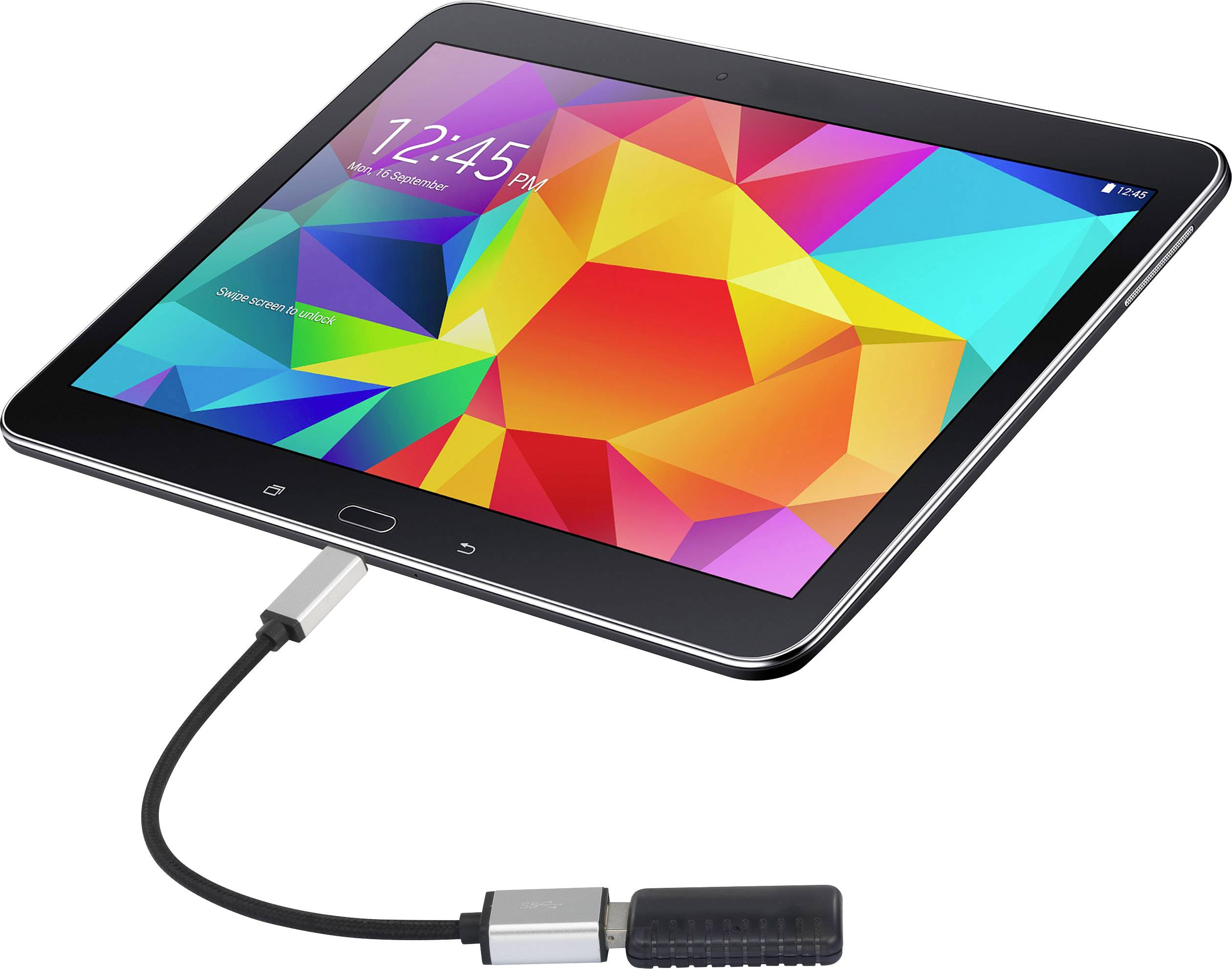 A tablet with a colourful display. It is connected via a cable to an adapter.