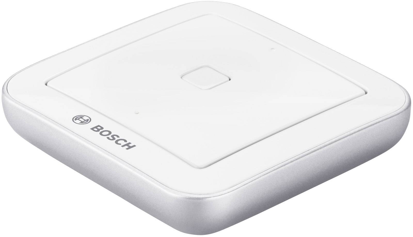 Square, white Bosch sensor with rounded corners. It features a central button and a Bosch logo in the corner.