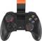 Black game controller with orange accents and mobile phone holder, showing control buttons and analogue sticks for console gaming.