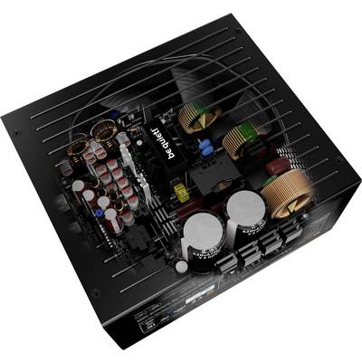 The image depicts the interior of a technical device with electronic components such as coils, capacitors, and circuit boards.