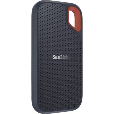A portable external SanDisk drive with a black, perforated surface and an orange accent along the edge.