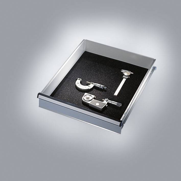 An open drawer insert reveals measuring tools: a vernier calliper and a depth gauge.