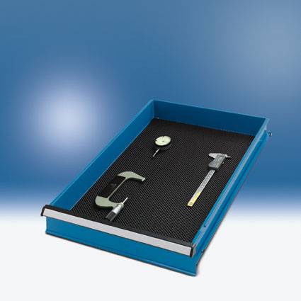 Blue drawer with a black insert for storing measuring tools such as vernier callipers and micrometers, against a blue background.